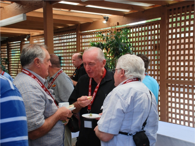 A group of longtime ANGFA members chatting over refreshments