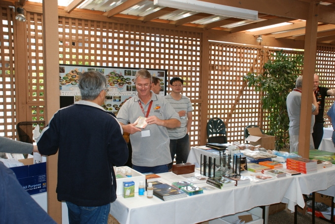 A vendor selling merchandise and books at the convention